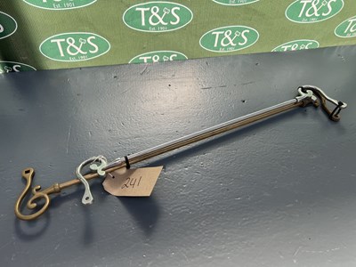 Lot 241 - Brass rein rail and a white metal rein rail