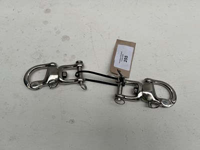 Lot 255 - Pair of stainless steel quick release snaps. This lot carries VAT.