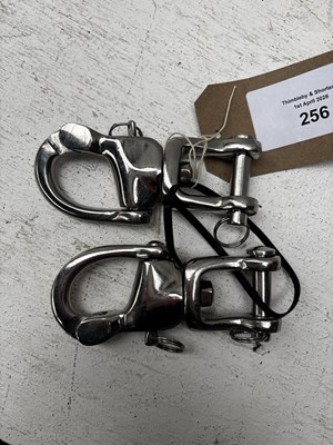 Lot 256 - Pair of stainless steel quick release snaps. This lot carries VAT.