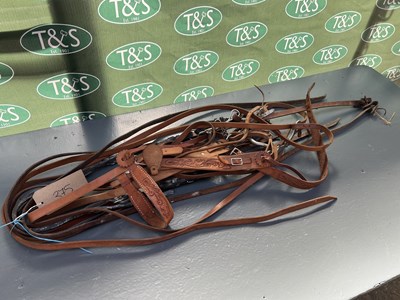 Lot 375 - Two Western bridles with reins and another pair of Western reins