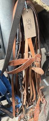 Lot 375 - Two Western bridles with reins and another pair of Western reins