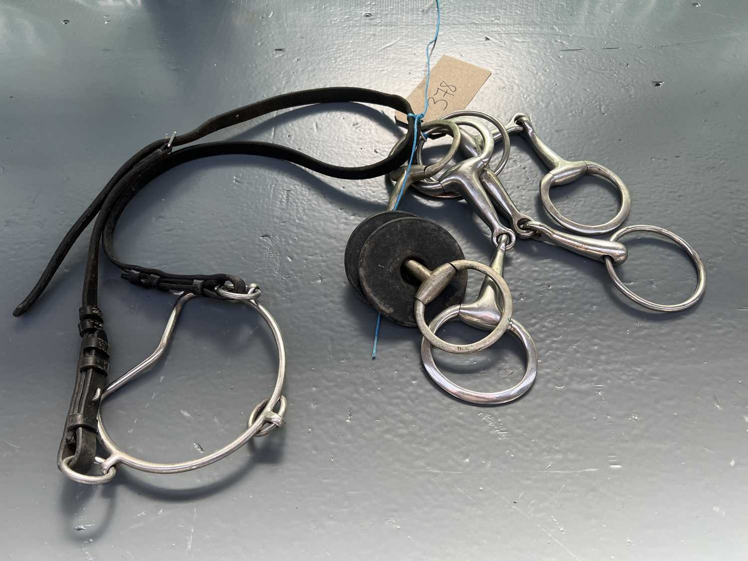 Lot 378 - Four jointed snaffle bits together with a