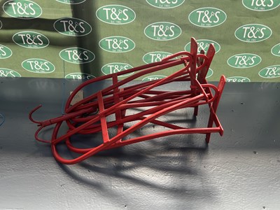 Lot 380 - Four red saddle racks together with a bridle hook