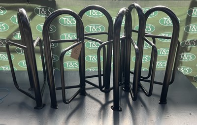 Lot 381 - Six black saddle racks