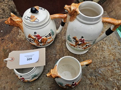 Lot 509 - Hunting scene pottery with fox design handles and spout