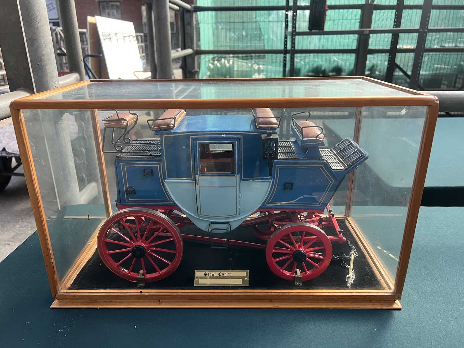 Lot 554 - Model of a stagecoach in glass cabinet 47 x 23 x 28 cms