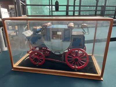 Lot 554 - Model of a stagecoach in glass cabinet 47 x 23 x 28 cms