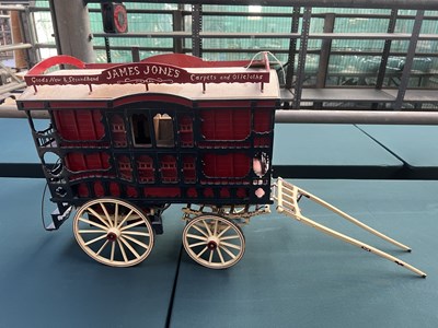 Lot 559 - Model of a second hand goods gypsy wagon complete with shafts, total length 80cm, height 45cm