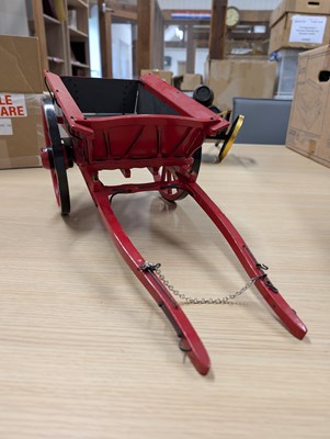Lot 592 - Model of a red two wheel cart