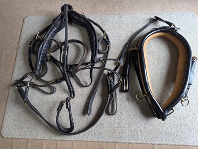 Lot 612 - Huskisson English black leather harness to fit 13.2-14.2hh cob, complete with 22" collar, brass fittings and breastplate.