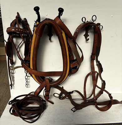 Lot 638 - Set of brown leather harness, complete with 23.5" collar, bridle and reins