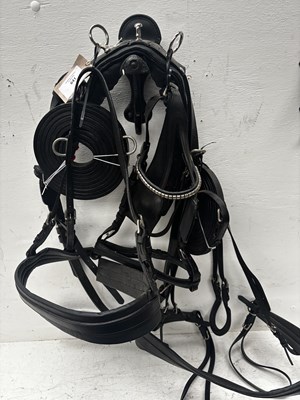 Lot 641 - Set of black and white metal pony harness. This lot carries VAT.