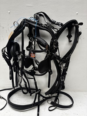 Lot 646 - Set of black and white metal pony harness with quick release tugs. This lot carries VAT.