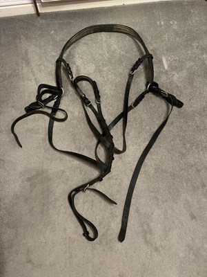 Lot 669 - Leather breast collar harness with bridle and bit