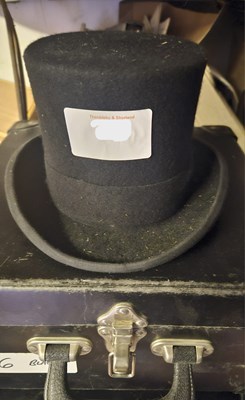 Lot 670 - Black top hat in case size 6