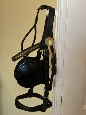 Lot 778 - Two driving bridles; one cob size black leather and brass with clincher browband; one large cob size brown leather
