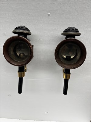 Lot 876 - Pair of black and brass round fronted carriage lamps