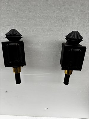Lot 880 - Pair of black lamps