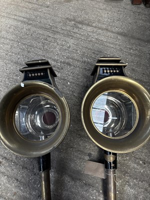 Lot 891 - Pair of large black and brass round fronted carriage lamps, height 29"