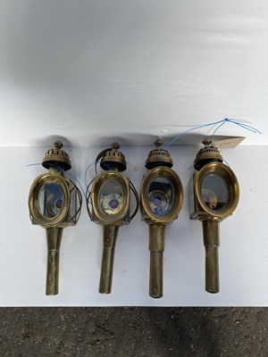 Lot 897 - Pair of brass oval fronted carriage lamps by Limehouse Lamp Company together with another set of brass oval fronted carriage lamps
