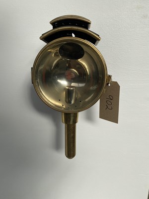 Lot 902 - Black and brass round fronted footboard lamp