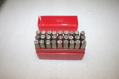 Lot 916 - Set of metal alphabet stamps for leather