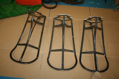 Lot 930 - Three antique saddle racks