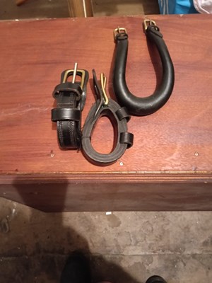 Lot 961 - Black pony show bridle with patent blinkers; a crupper; and a pair of Tilbury tugs