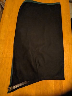 Lot 969 - Black driving apron with green edging, size medium