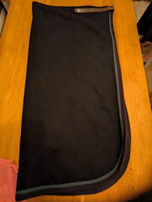 Lot 970 - Black driving apron with green edging, size large