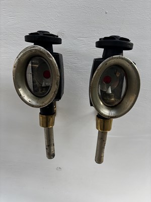 Lot 992 - Pair of black oval lamps