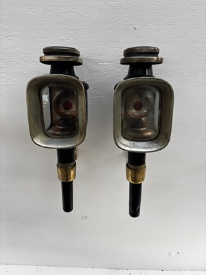 Lot 993 - Pair of black lamps