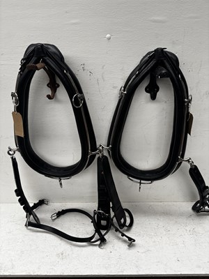 Lot 1051 - Pair of 23" black collars with white metal hames. This lot carries VAT.