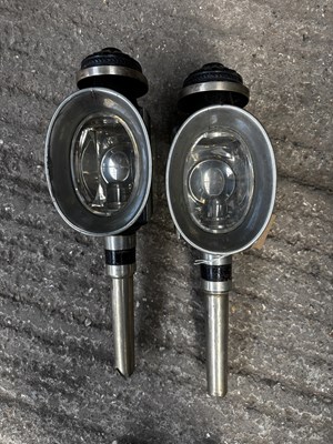 Lot 1085 - Pair of white metal oval fronted lamps by Hays & Sons of Stamford and London
