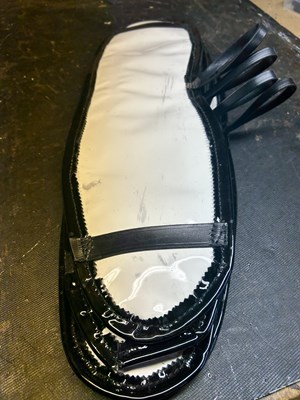 Lot 1098 - Set of four white and black under sweat pads