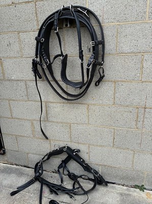 Lot 1103 - Part set of black and white metal single breast collar harness with quick release tugs and full breeching. No reins or bridle.