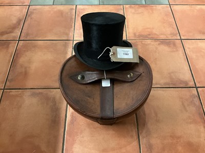 Lot 1163 - Top hat with leather box, size 7 1/4