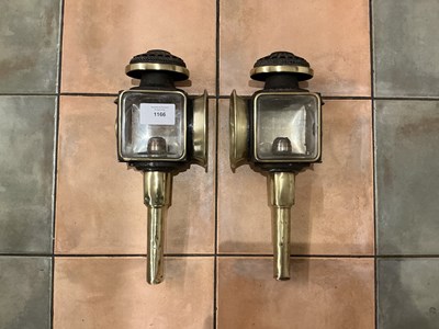 Lot 1166 - Pair of black and brass lamps made by Slack, Manchester