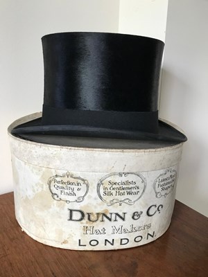 Lot 1175 - Black silk top hat by Dunn & Co. in original box