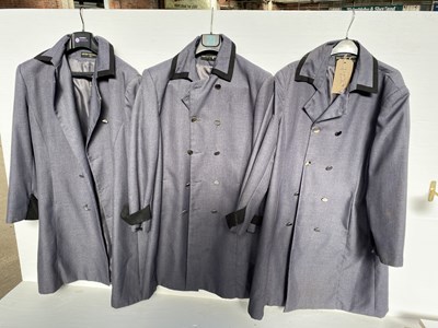 Lot 1229 - Three grey Livery coats, sizes L-XXL with white metal buttons