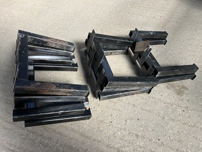 Lot 1249 - Ten black painted metal homemade harness racks