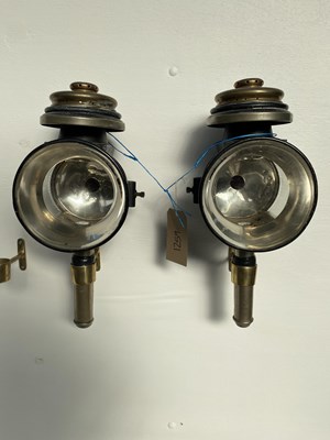 Lot 1259 - Pair of black and brass round-fronted carriage lamps by Riddle Coach & Hearse Co. of Ravenna, Ohio