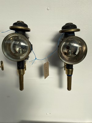 Lot 1265 - Pair of black and brass round-fronted carriage lamps by P & A Cordes of Uelzen, Germany; together with a pair of black and brass round-fronted lamps with convex lenses