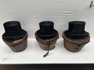 Lot 1270 - Three black top hats, all requiring restoration