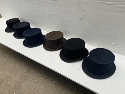 Lot 1274 - Three blue wool top hats; two black top hats and a brown top hat