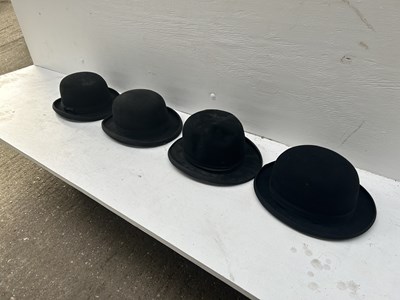 Lot 1277 - Four black bowler hats