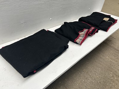 Lot 1282 - Three driving aprons with check lining