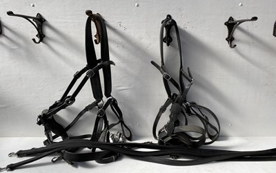 Lot 1289 - Pair of breast collars, black and white metal together with a set of four traces
