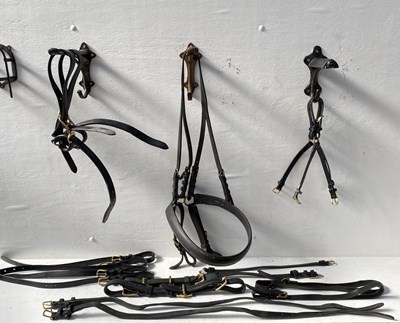 Lot 1292 - Black and brass breeching and various harness parts