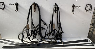 Lot 1299 - Pair of black and white metal breeching; pair of black and brass breeching; together with two pairs of traces